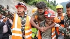 'A rare moment of joy': Nepal tunnel rescues bring hope for more flood survivors